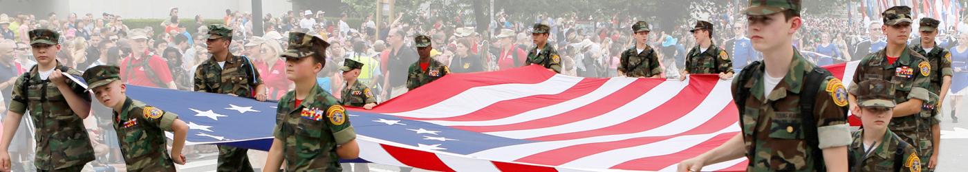 Young Marines carrying Flag